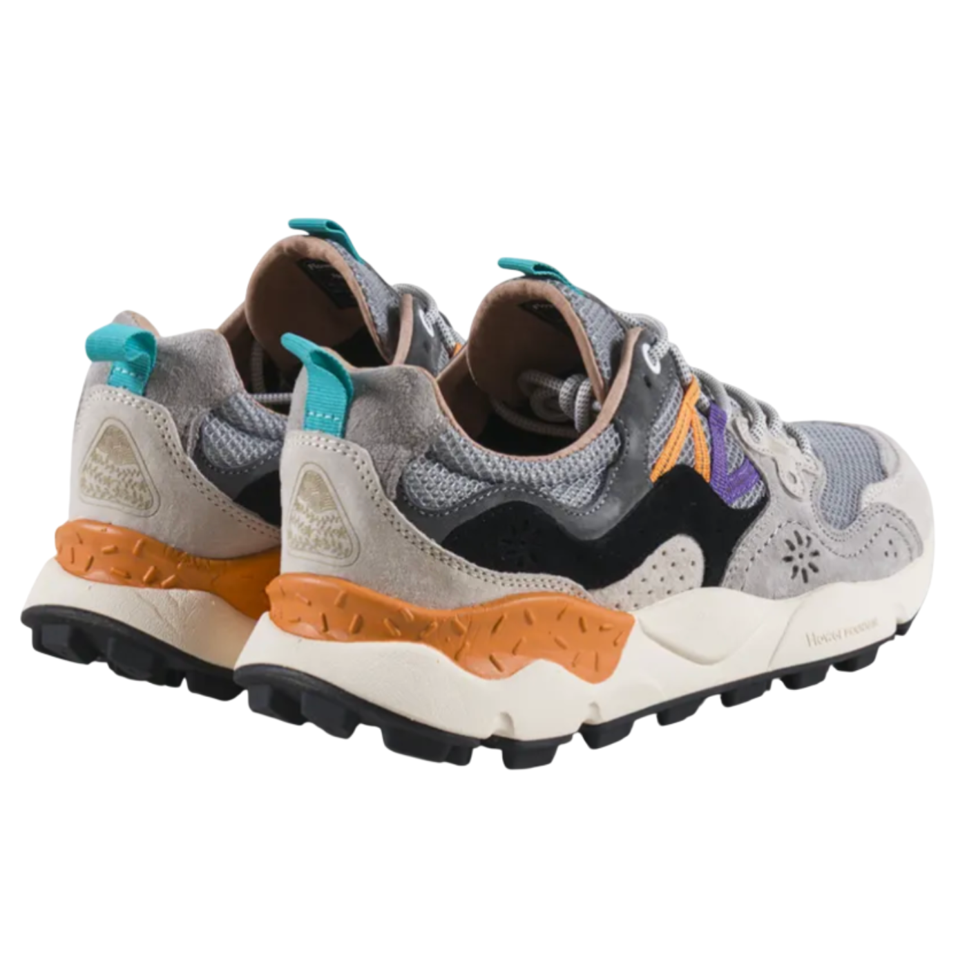 Pair of gray and orange sneakers on a white background