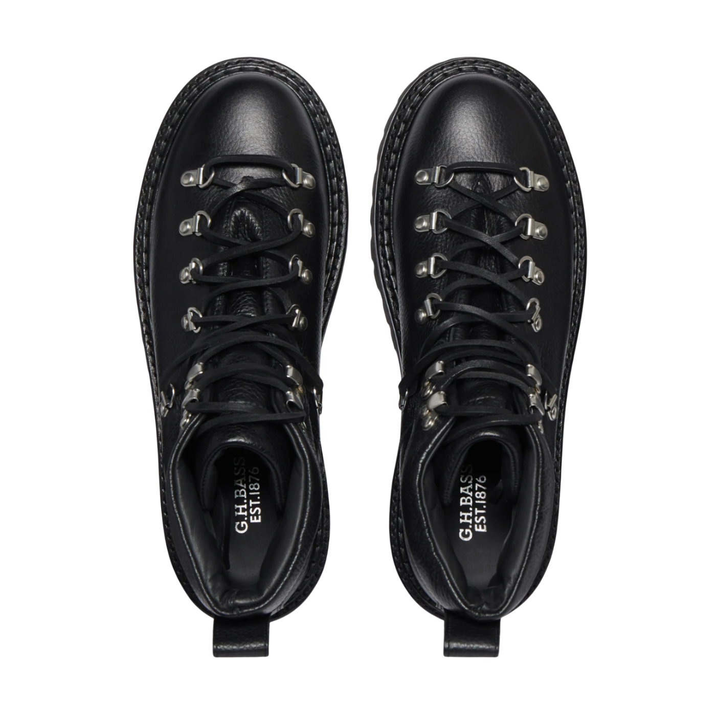 Pair of black leather boots with studded details on a white background