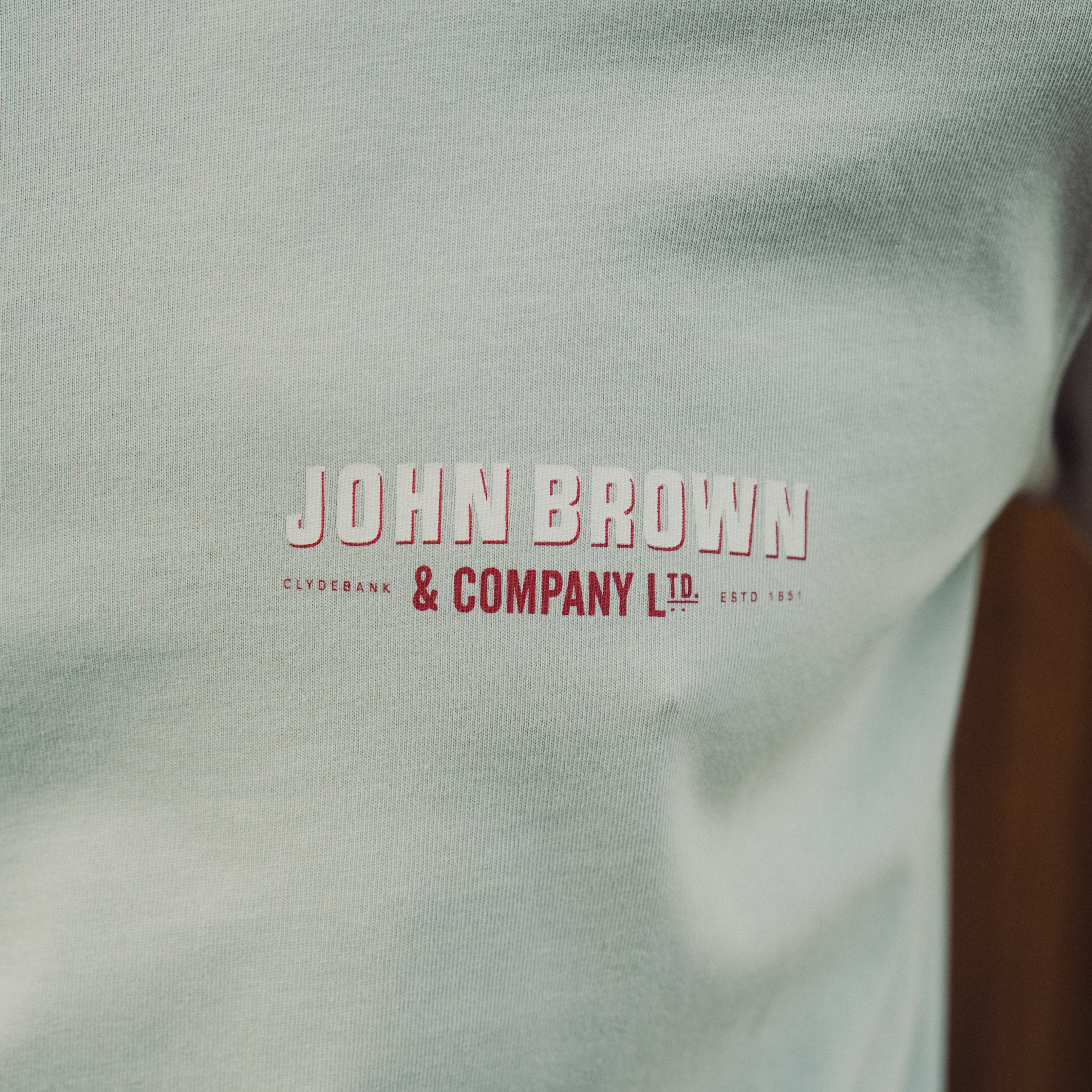 Light gray fabric with 'John Brown & Company Ltd' logo in red and white.