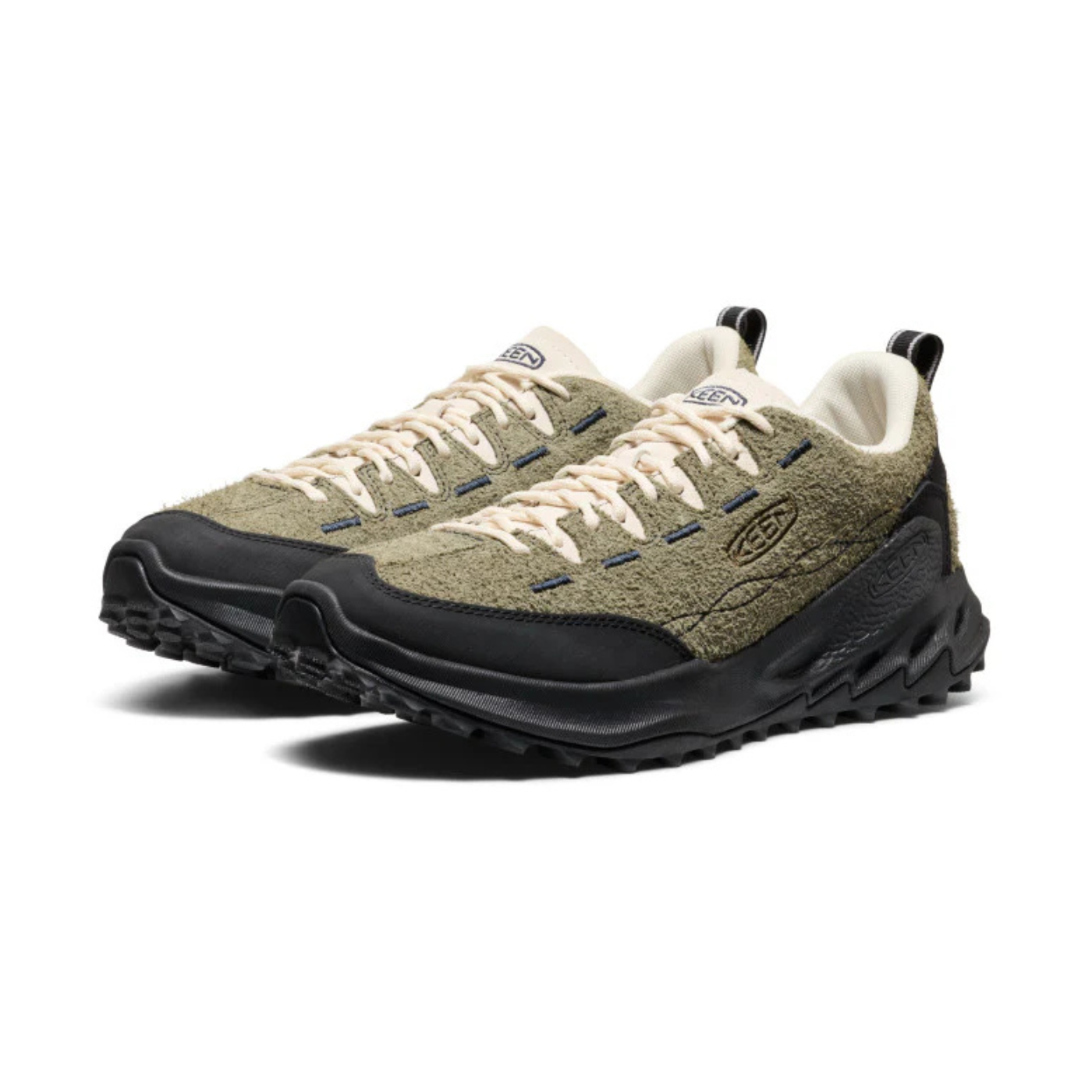 Pair of hiking shoes with green and black design on a white background
