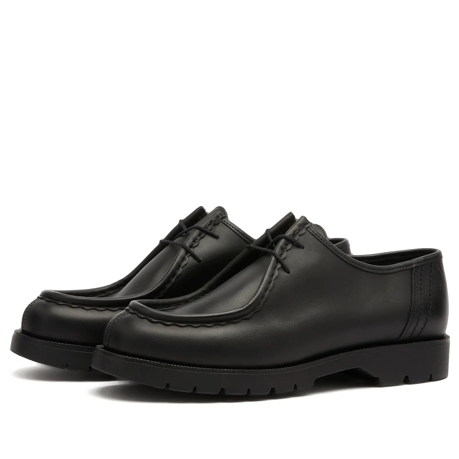 Pair of black leather Kleman Padror shoes on a white background