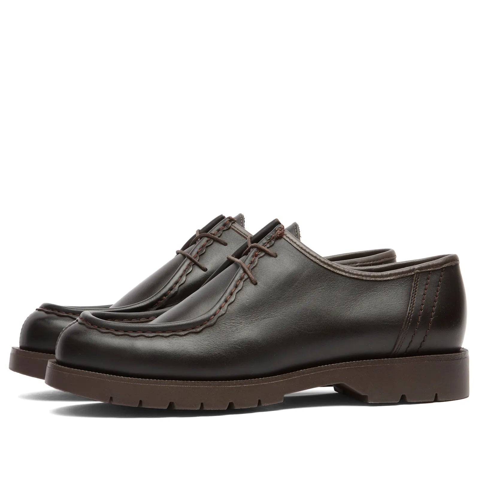 Pair of brown leather Kleman shoes on a white background