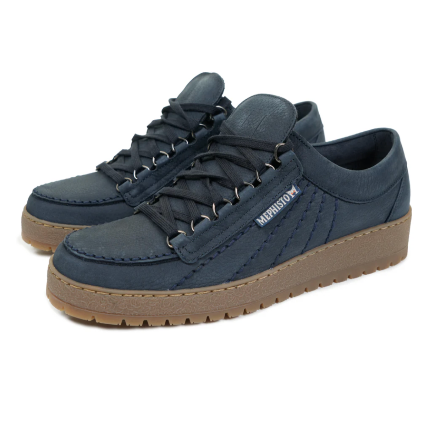 Pair of blue sneakers with brown soles on a white background