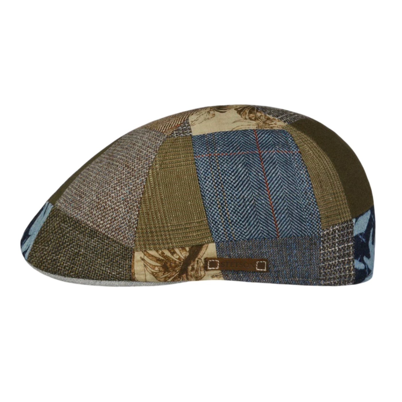 Patchwork cap with various fabric patterns on a white background