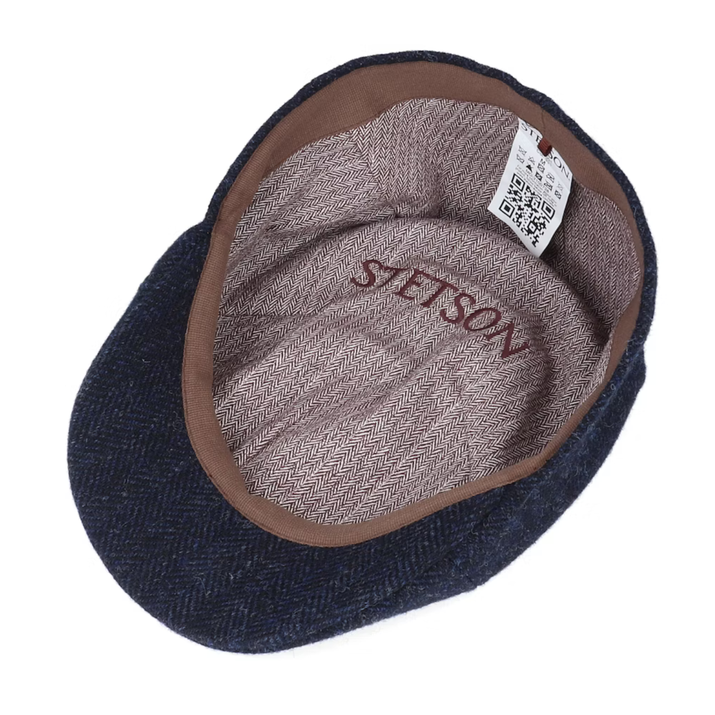 Blue flat cap with brown interior and 'Stetson' branding on a white background