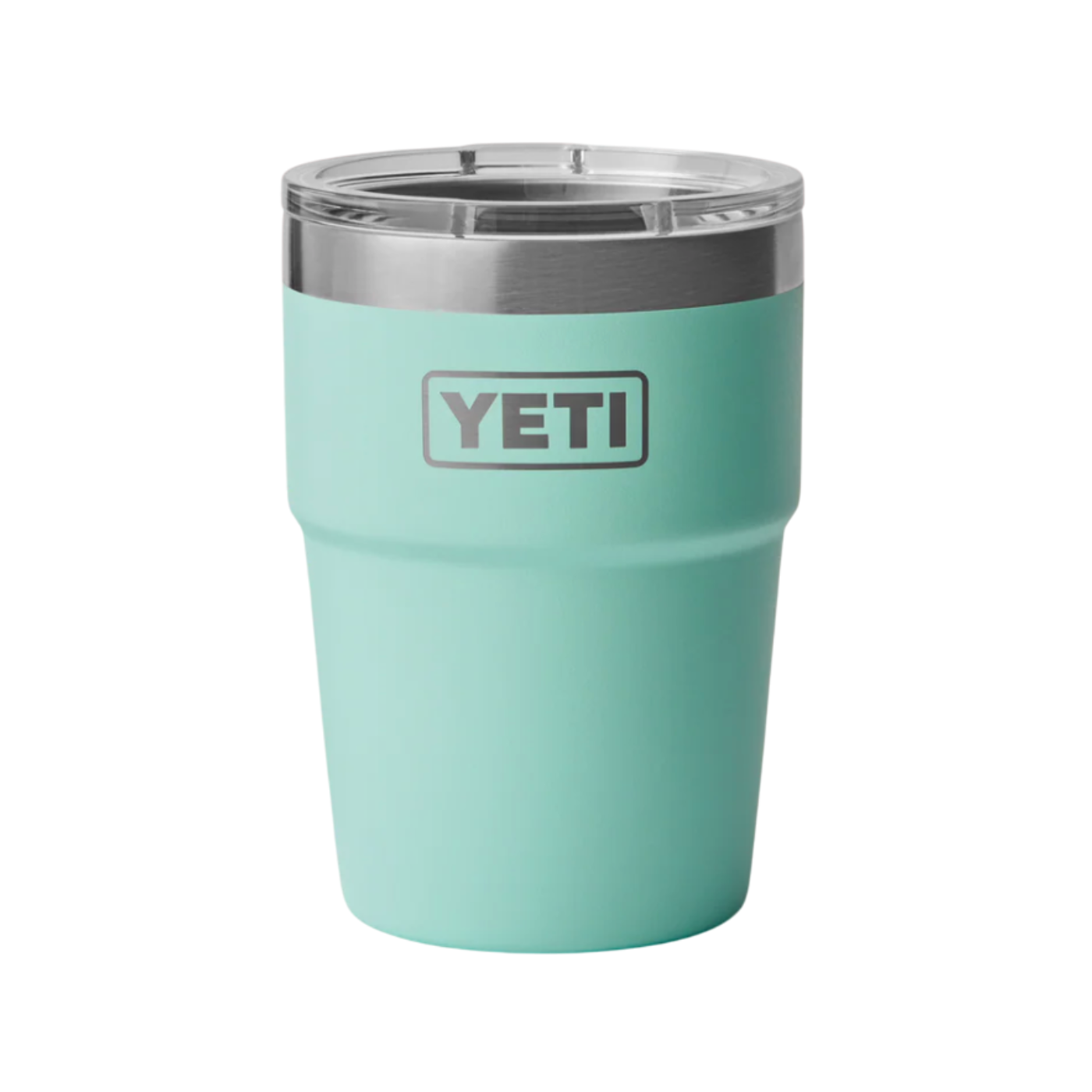 Turquoise YETI tumbler with a silver rim on a white background