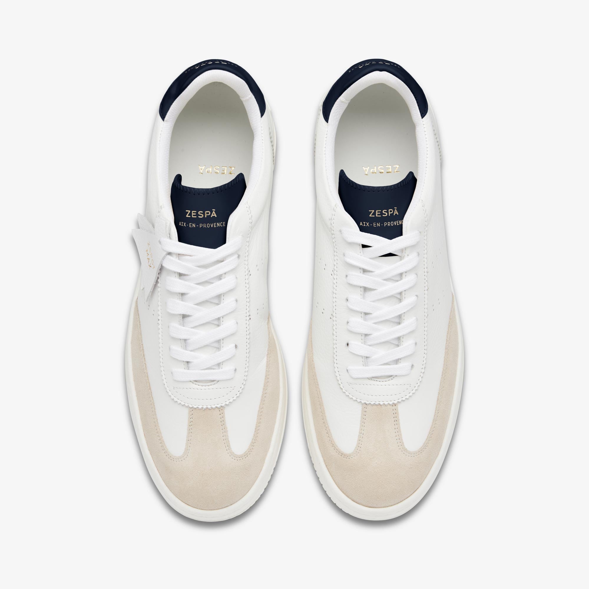 White Zespa sneakers with navy accents on a white background