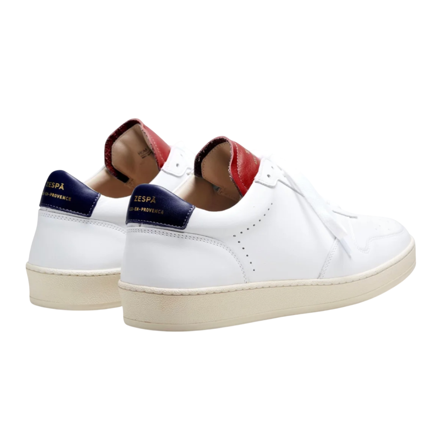 White sneakers with red and blue accents on a white background