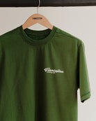 Green t-shirt with 'Finnieston' logo on a hanger against a white background