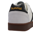 Close-up of a sneaker with 'hummel' branding on a white background