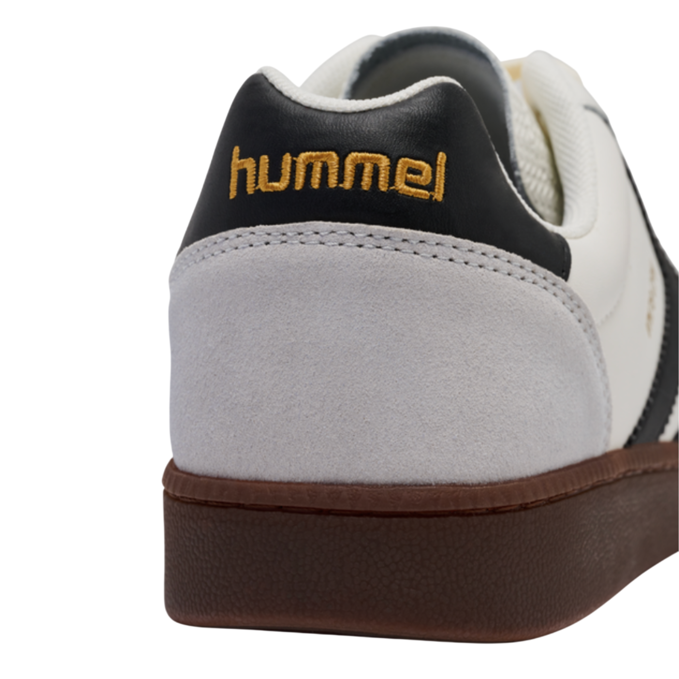 Close-up of a sneaker with 'hummel' branding on a white background