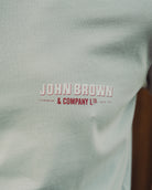 Light gray fabric with 'John Brown & Company Ltd' logo in red and white.