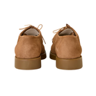 Pair of brown suede shoes on a white background