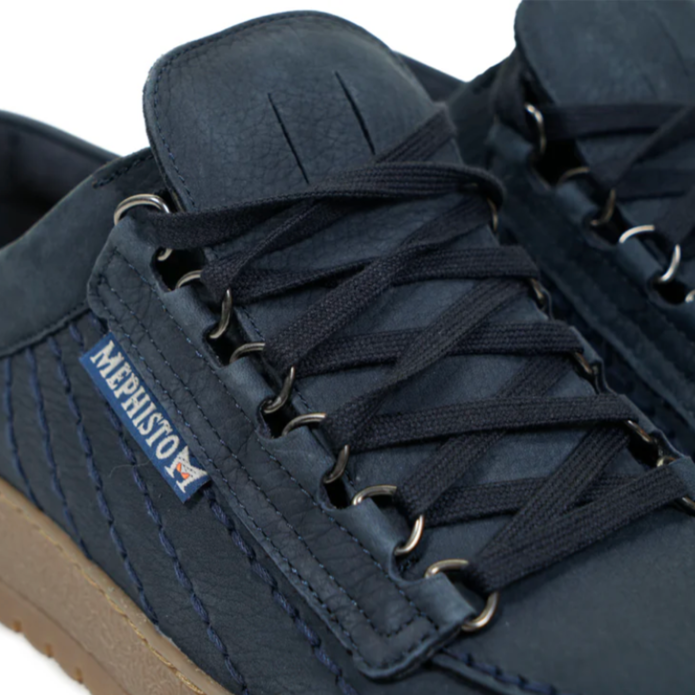 Navy blue shoe with laces and Mephisto logo on a white background