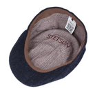 Blue flat cap with brown interior and 'Stetson' branding on a white background