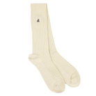 White ribbed sock with a small logo on a white background