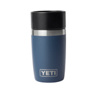 Blue YETI insulated mug with black lid on a white background