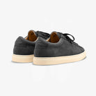 Pair of black Zespa sneakers with beige soles on a light gray background
